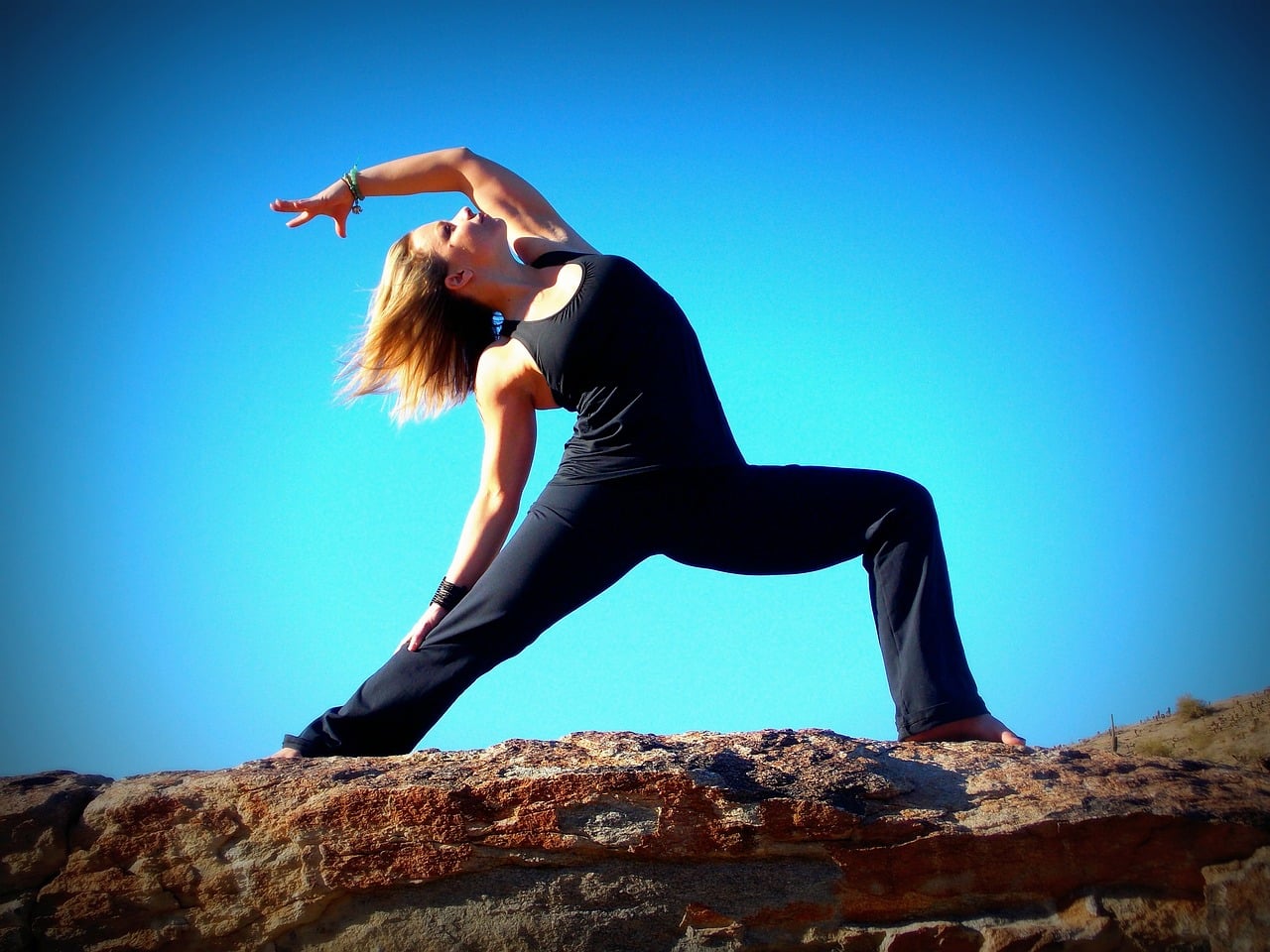 older woman doing yoga