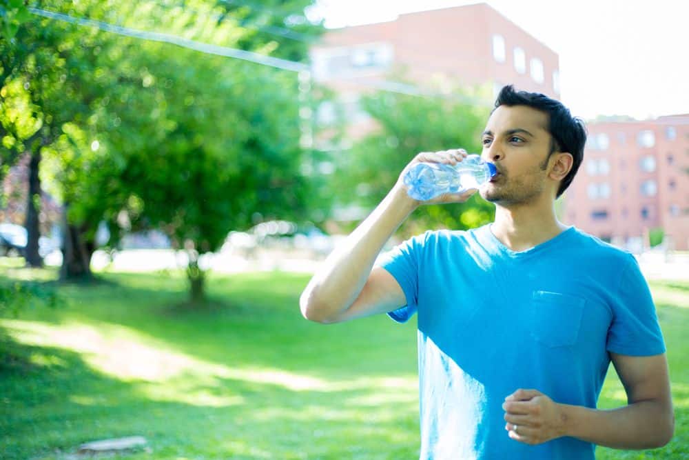 man drinking water