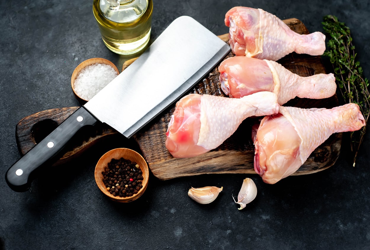 Premium Photo  Raw chicken on a cutter board with vegetables and spices